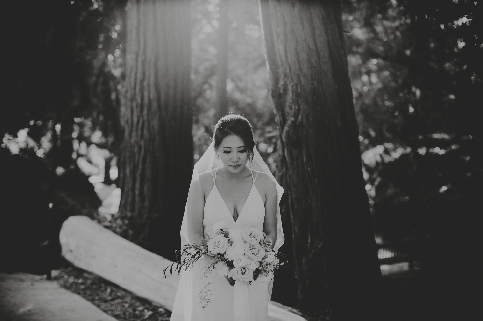 bride in black and white holding her flowers